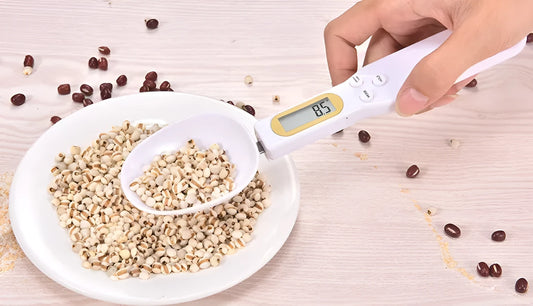 Black electronic measuring spoon scale showing digital display with spoon bowl for kitchen weighing
