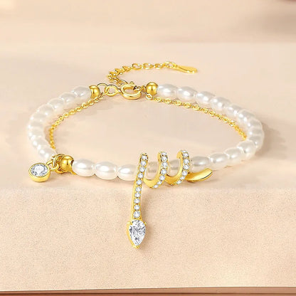 Pearl snake bracelet in 925 silver with electroplated gold or white gold finish and geometric animal design