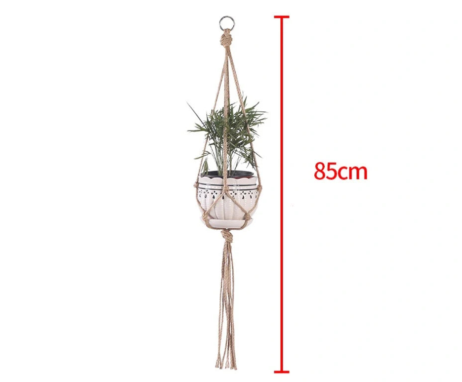 Hand-woven cotton rope hanging plant basket in natural jute, perfect for home decor.