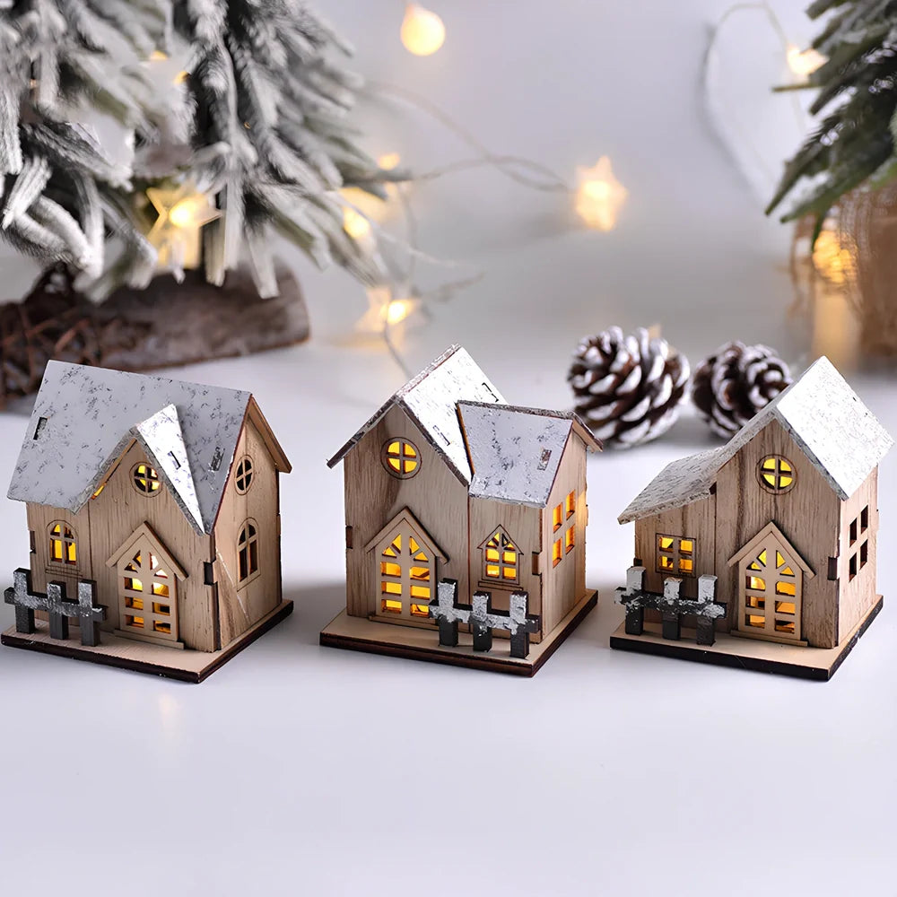 LED illuminated wooden Christmas cabin measuring 8cm by 7cm by 9.5cm with festive lighting