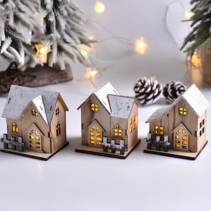 LED illuminated wooden Christmas cabin measuring 8cm by 7cm by 9.5cm with festive lighting