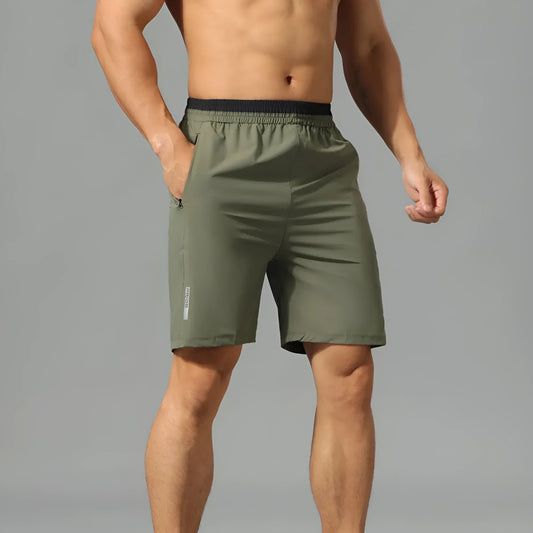 Men's loose grey ice silk cropped running pants showing the fifth pants length and relaxed fit.