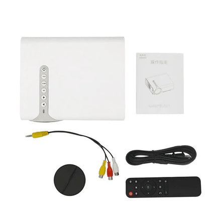Black and white versions of the YG530 mini wireless mobile phone projector on a table.
