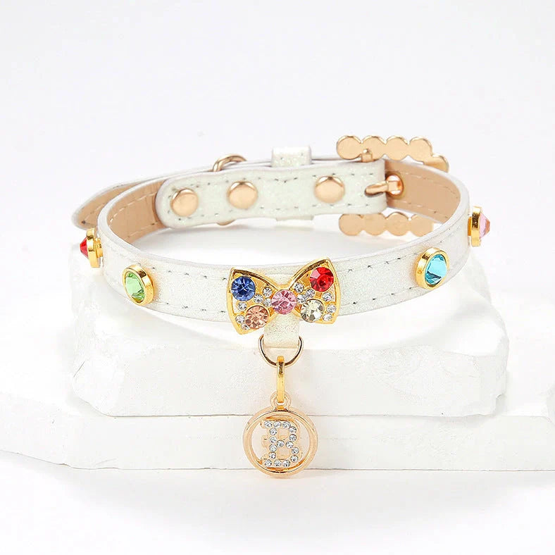 White cat collar with silver diamond alloy bow showing four size options from 26cm to 38cm length