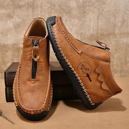 Men's slip-on loafers in black with round toe and sewing thread details, showing rubber sole