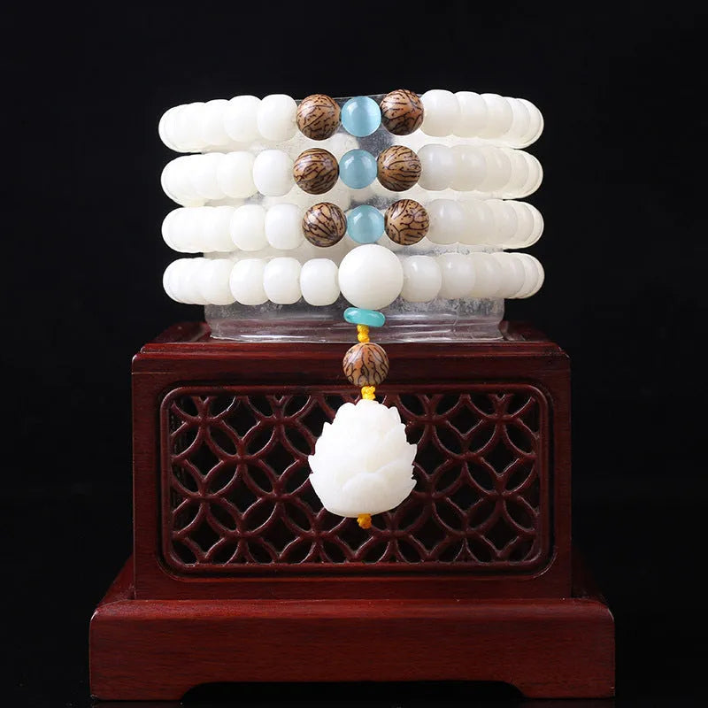 A long white jade Bodhi bead bracelet with 6x8mm beads, shown in various style options including cloisonne and lotus designs.