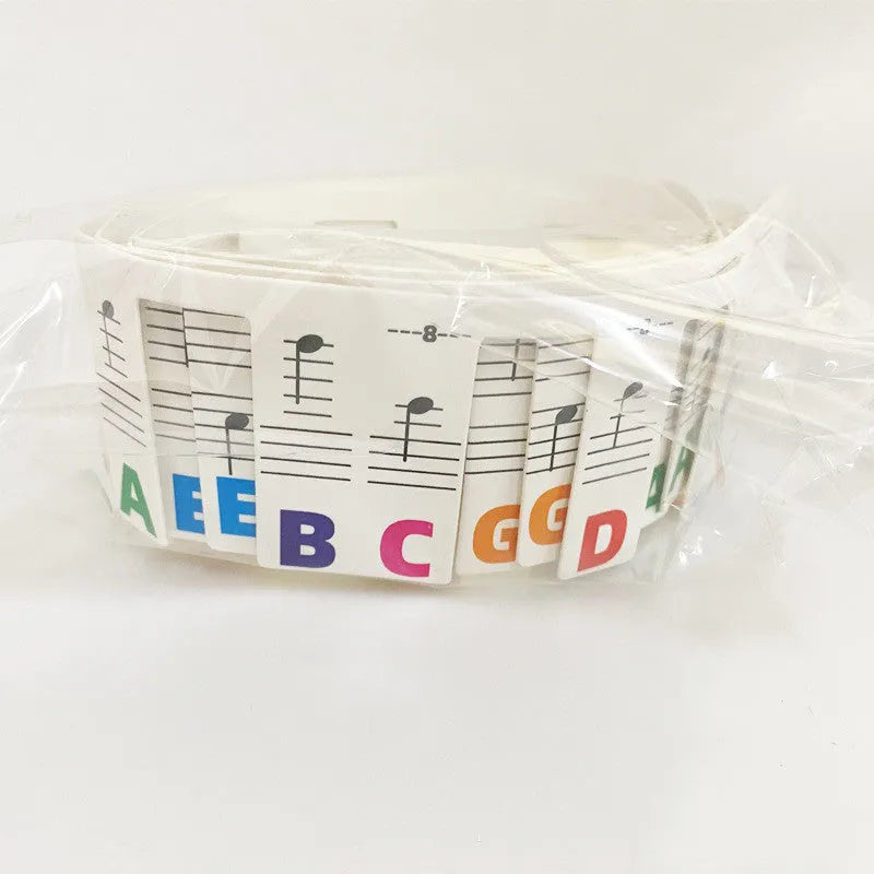 Piano keyboard stickers for 88-key pianos showing white card staff notation with colour bars and black notes
