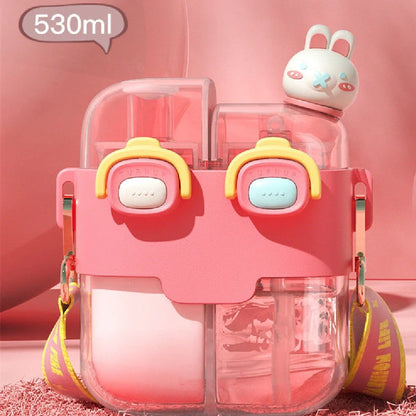 Plastic water bottle with spring cover in coral pink, measures 11.3x20.5x7cm