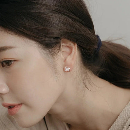Elegant silver bow stud earrings for women, hypoallergenic and perfect for any occasion.