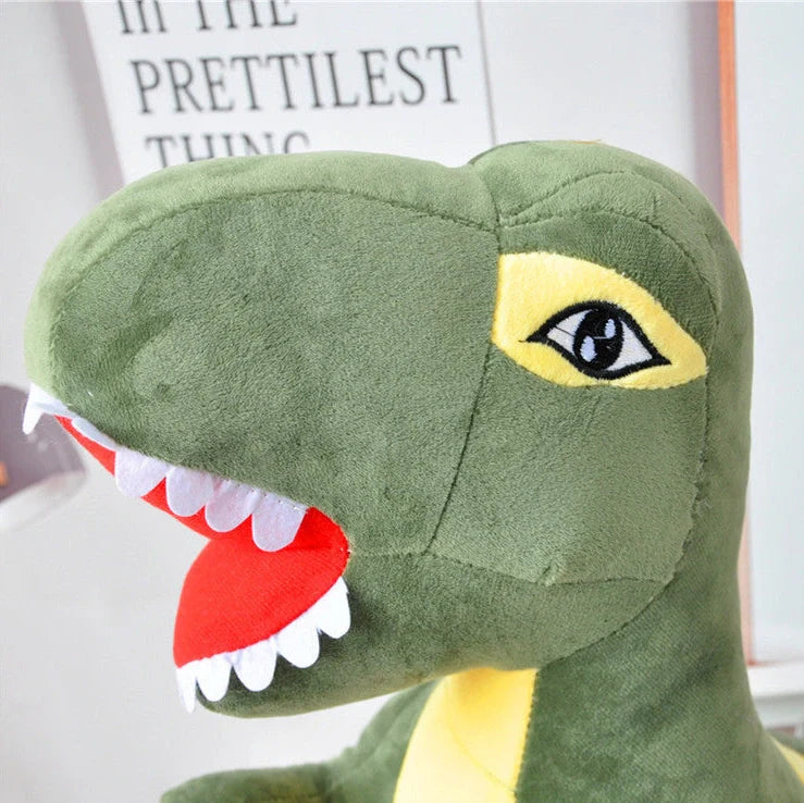 Green dinosaur plush toy with reversible sequins showing flipped design patterns