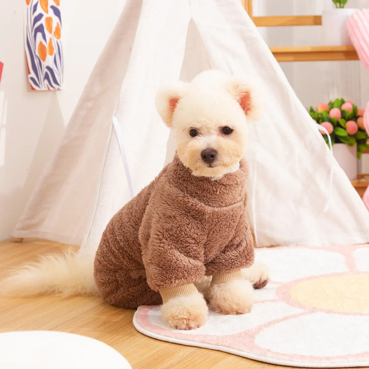 Blue double-sided plush four-legged dog clothing with high collar and towing ring laid flat.
