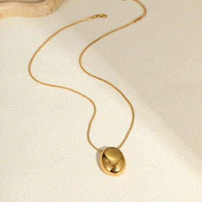 Gold-toned geometric pendant necklace on a chain, showing adjustable length between 41 cm and 50 cm.