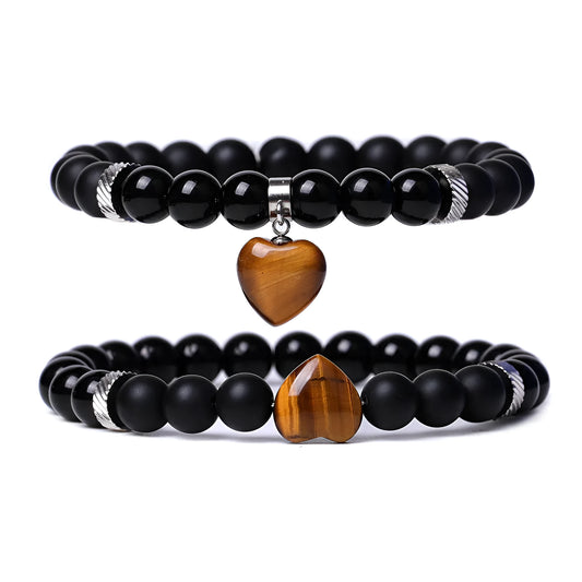 Matching couple bracelets with polished natural stone heart pendants in geometric style
