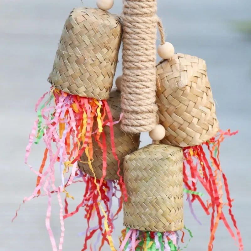 Wooden parrot chew toy with colourful shredded paper measuring 15x35cm