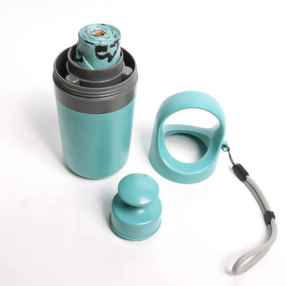 Blue portable claw-style dog pooper scooper with a roll of disposable bags for outdoor pet waste clean-up.