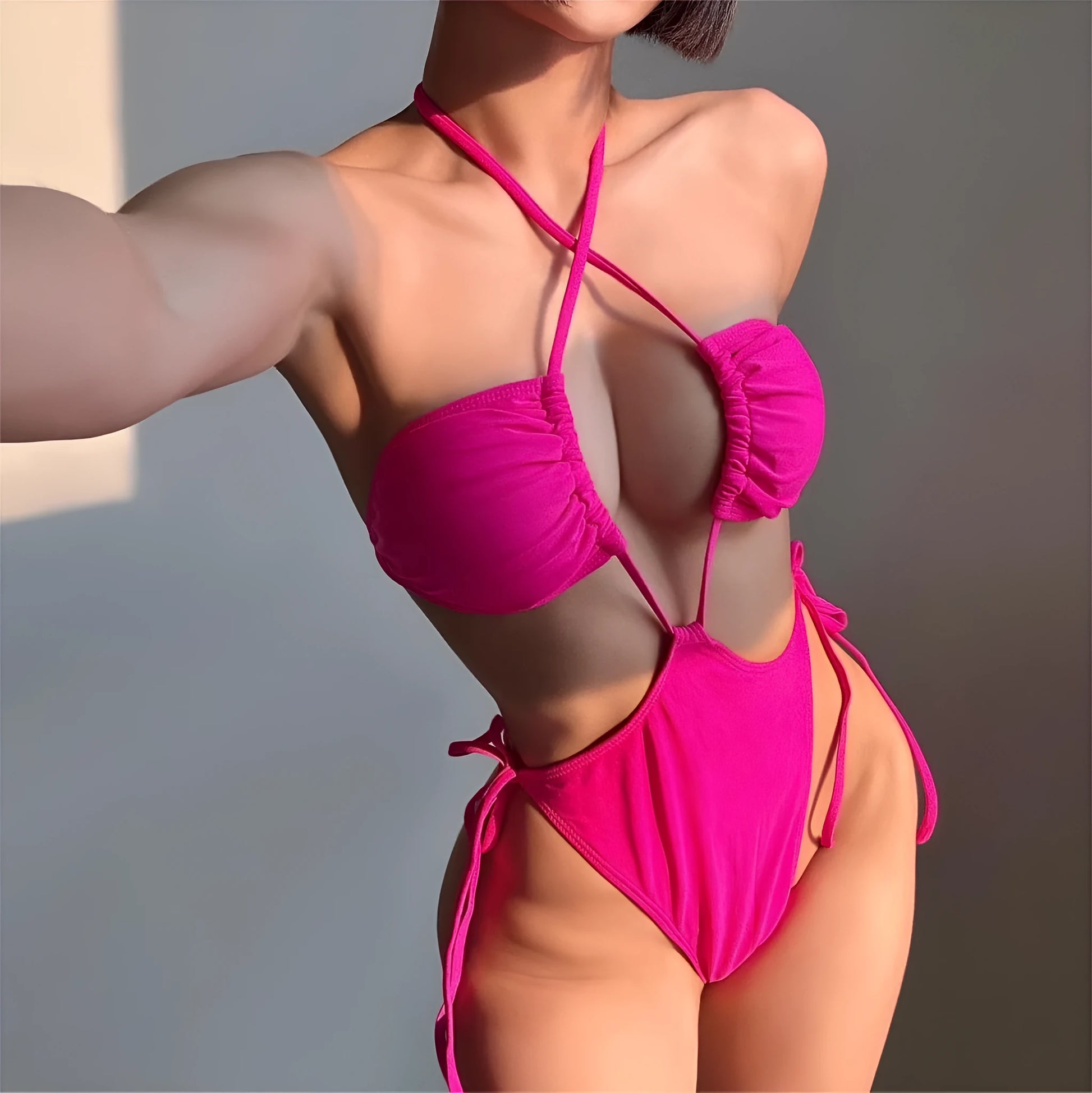 Women's solid colour one-piece swimsuit with drawstring fastening in nylon fabric.