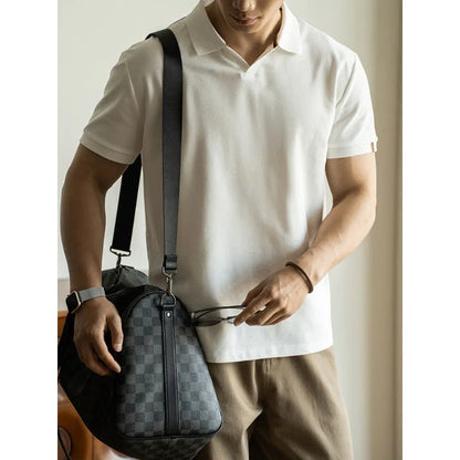 Light blue cotton polyester short-sleeved polo shirt on a hanger.