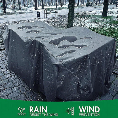 Waterproof furniture cover protecting outdoor table and chairs from rain with integrated storage bag