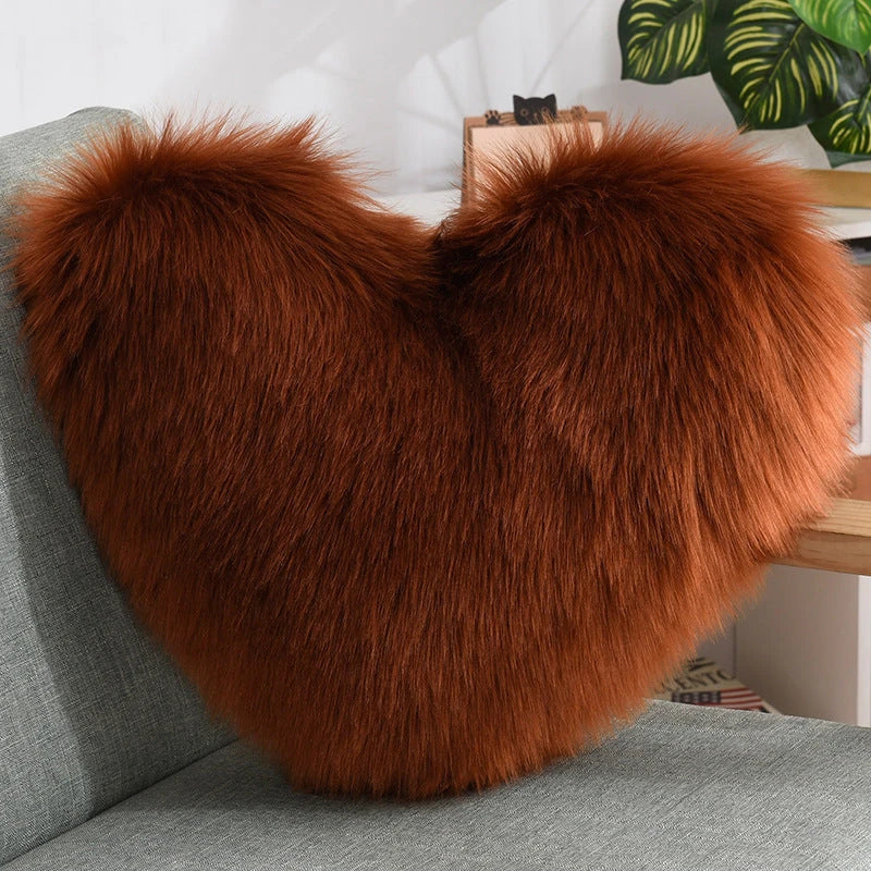 Cozy heart-shaped plush throw pillows in various colors and sizes for living room and bedroom decor