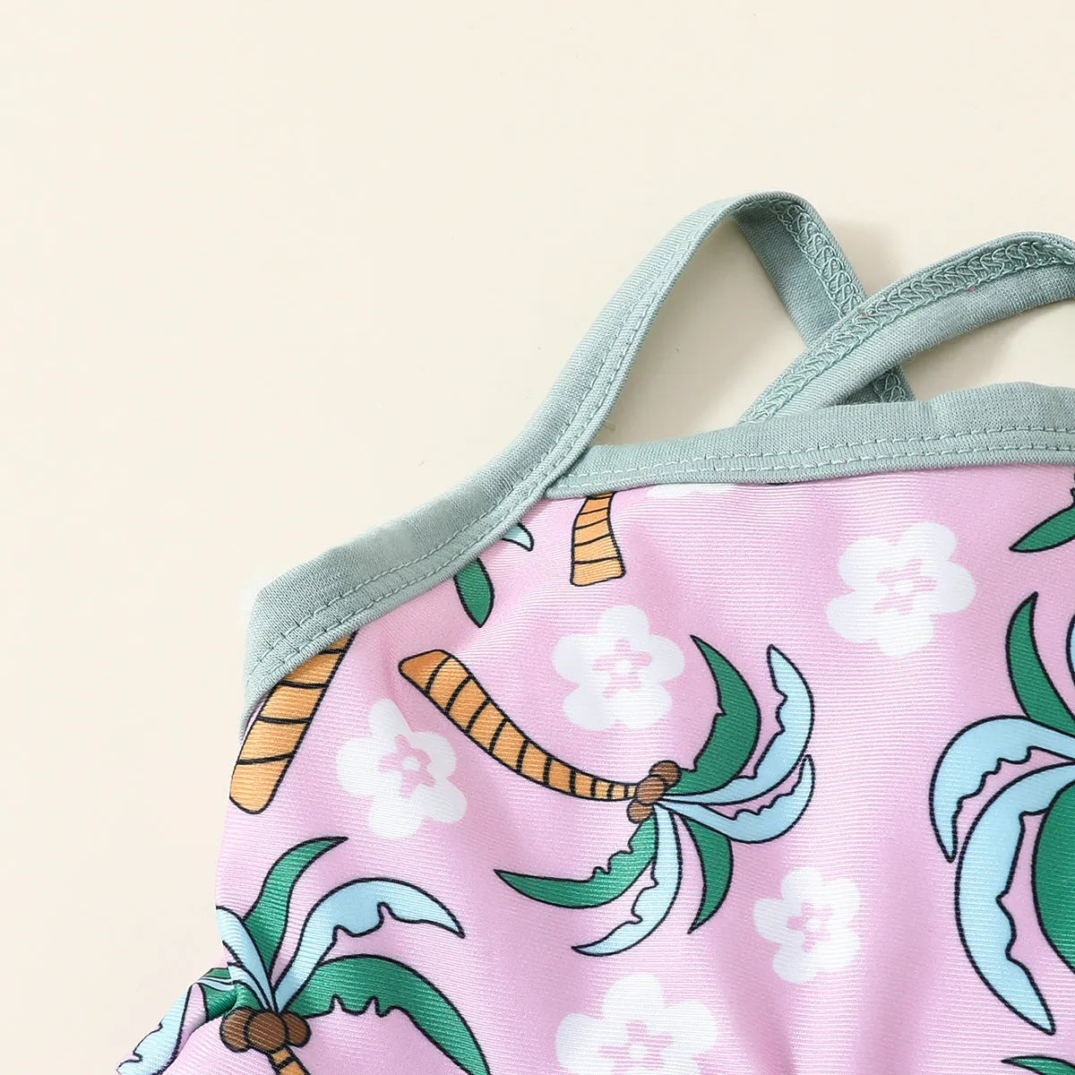 White children's two-piece polyester swimsuit set with a top and shorts on a hanger.