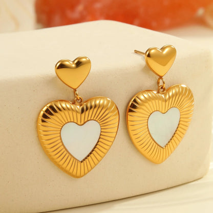 Gold-colour heart-shaped earrings with white fritillary design on stainless steel with electroplating
