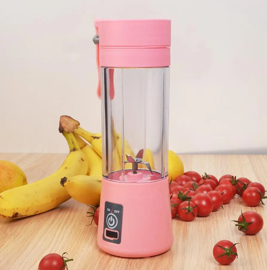 Pink portable USB electric fruit juicer blender cup with stainless steel blade and carry handle.