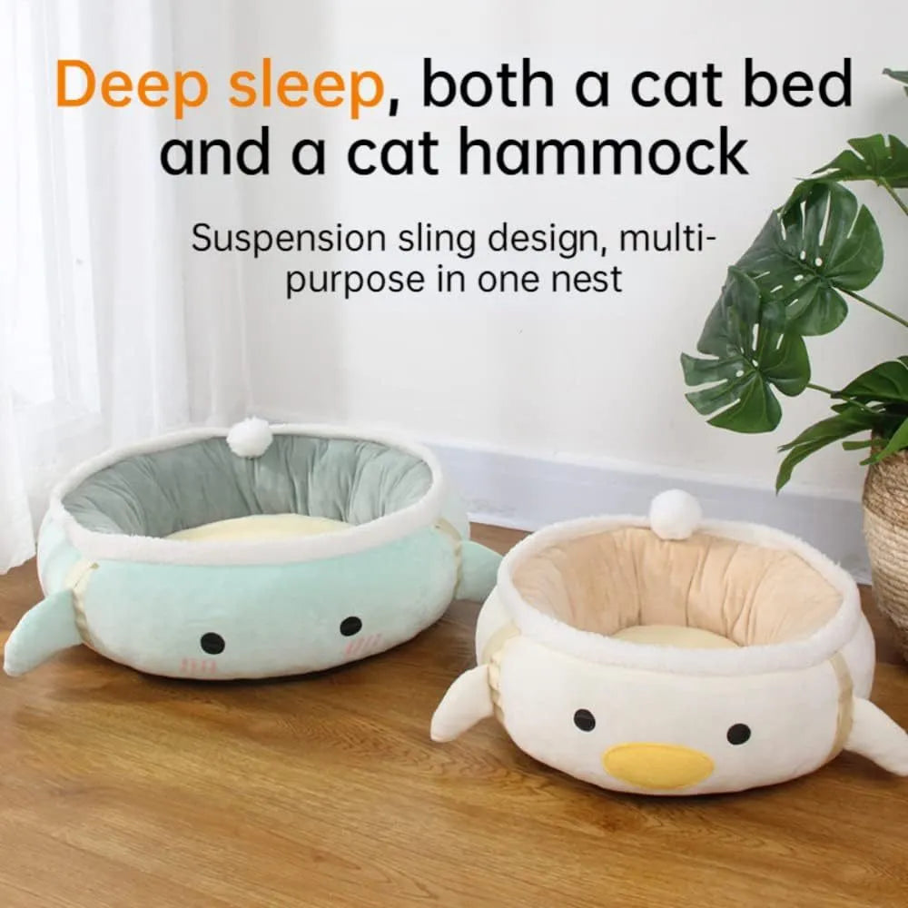 Green chick-shaped cat bed laid flat with hanging straps attached, suitable for small cats