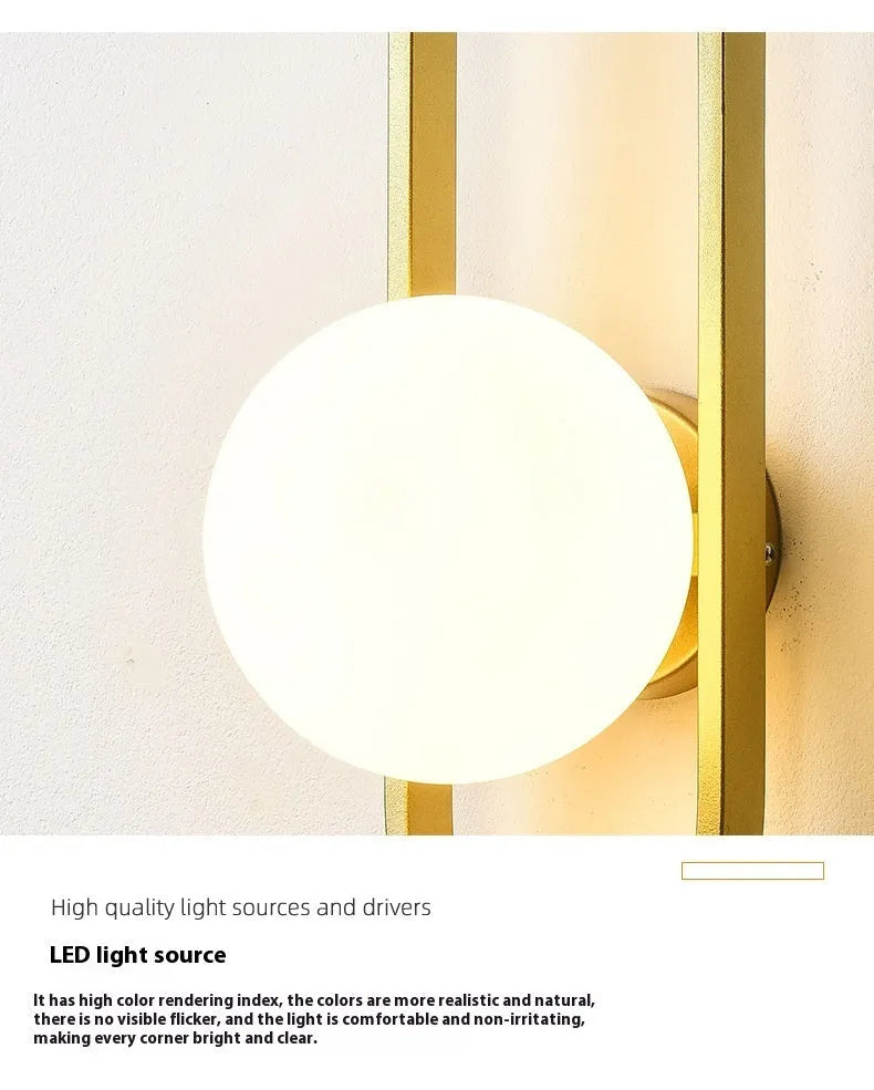 Minimalist wall lamp in black or gold finish with glass shade and 12W tri-colour LED lighting