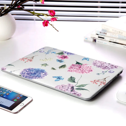 Plastic protective shell with floral pattern for Apple MacBook laptop showing sampling flower design