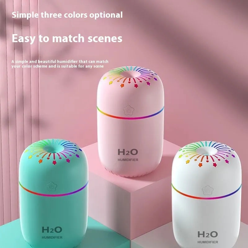 White USB mini humidifier with 300ml tank on desk beside laptop showing compact 75x75x116mm size