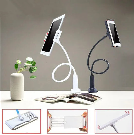 Bedside oversize flat panel handset with long arm holding a mobile phone on a table