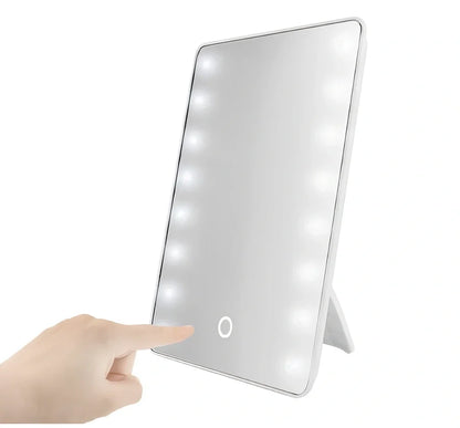 Black LED makeup mirror with 16 lights around 225mm × 165mm frame on dressing table