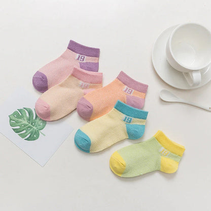Premium cotton baby socks in various vibrant colors and sizes for boys and girls