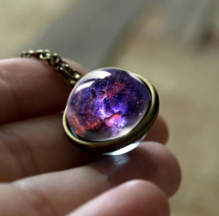 Mesmerizing double-sided galaxy pendant necklace in various celestial patterns and colors
