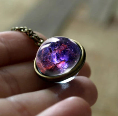 Mesmerizing double-sided galaxy pendant necklace in various celestial patterns and colors