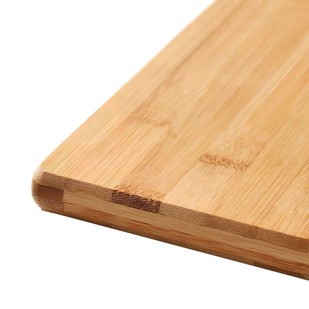 Bamboo cutting board with curved handle showing natural wood grain, rectangular shape with four size options