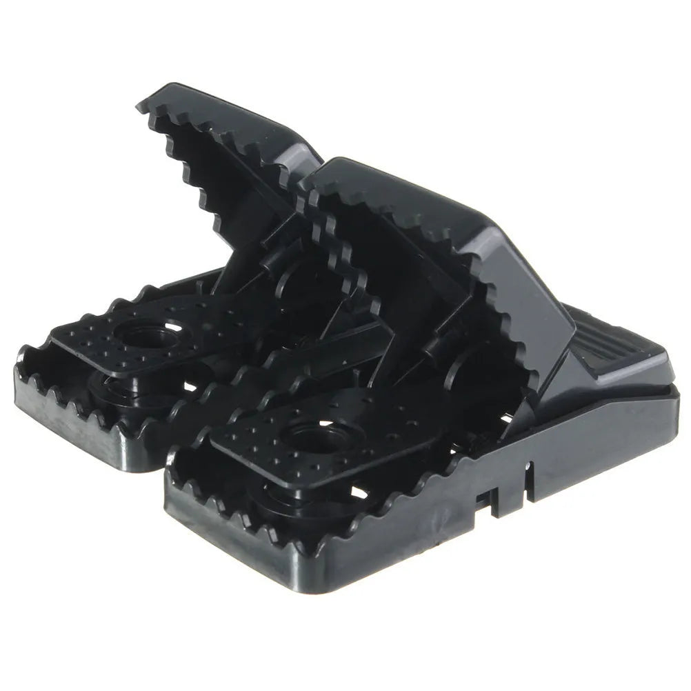 Six black plastic snapping mousetraps showing quick-kill mechanism and compact 11cm size