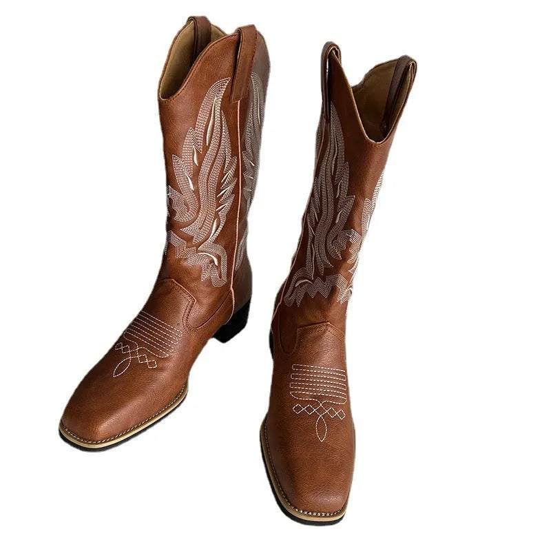 Brown women's mid-calf Martin boots with embroidered detail on the shaft.