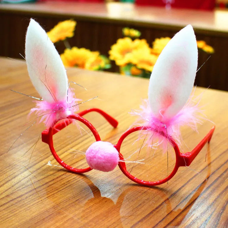 Christmas glasses with festive frame decorations in assorted novelty styles including Santa Claus, snowman and rabbit ears designs made from plastic and fabric materials