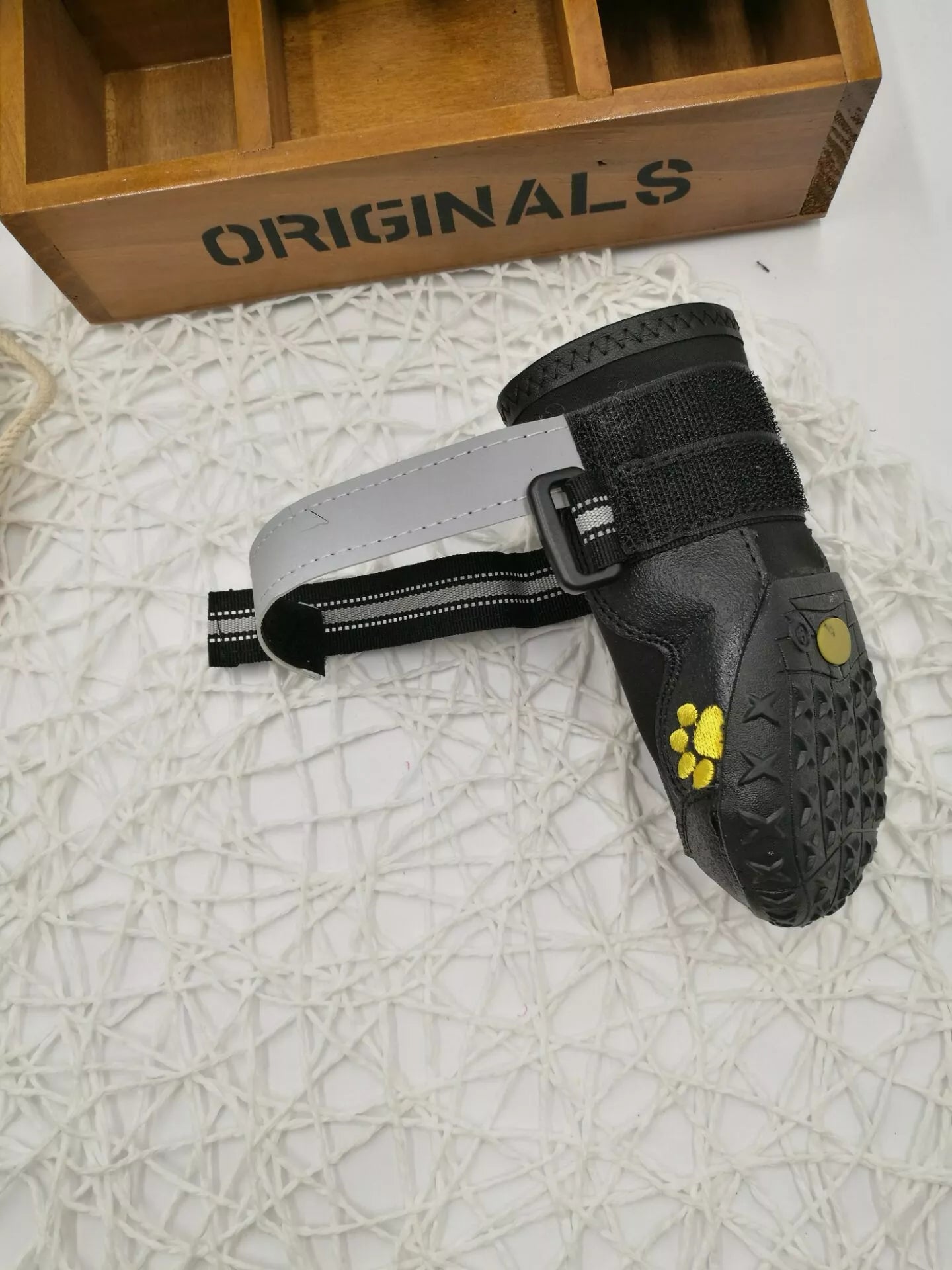 Black waterproof dog shoes with non-slip soles and adjustable fuzzy belts