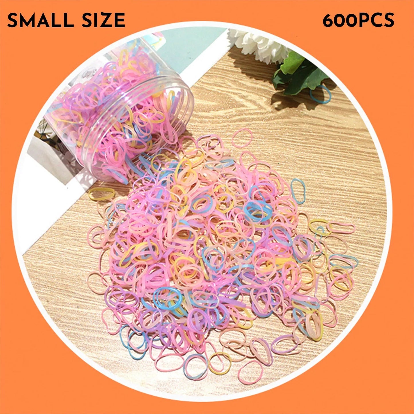 Multicoloured assortment of thin TPU elastic hair bands for babies and children in a reusable plastic container.