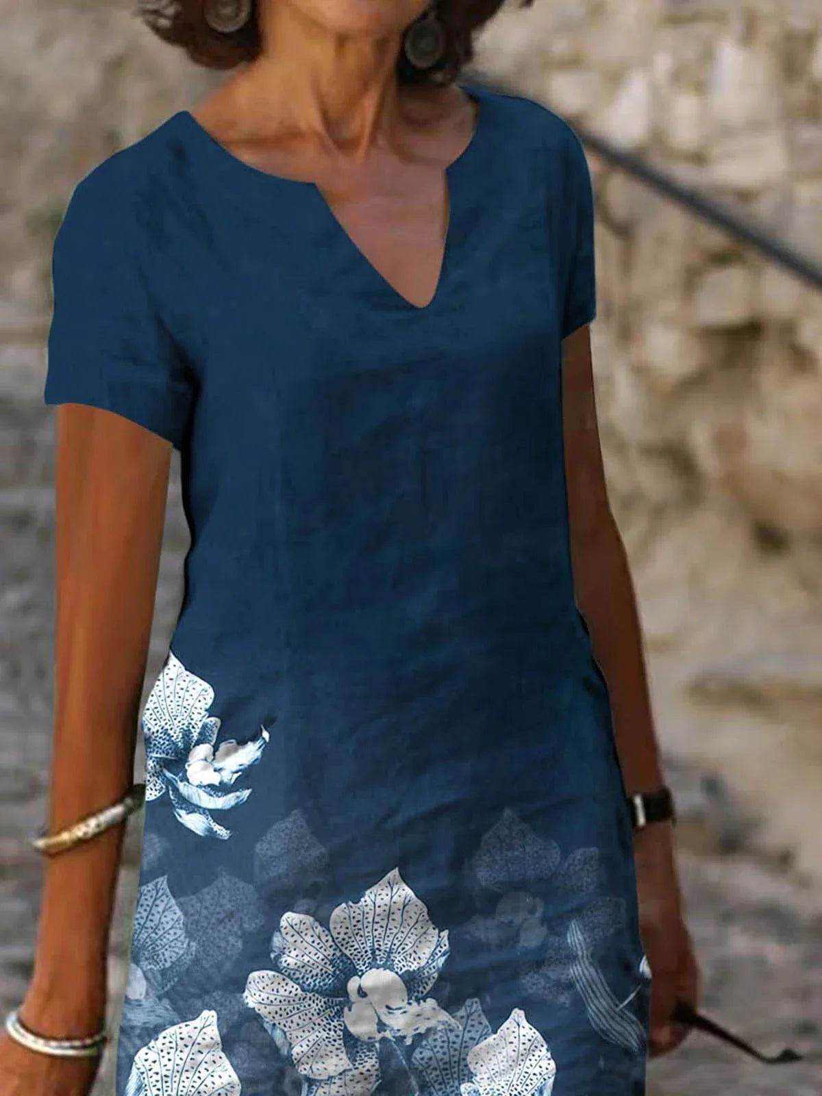 Stylish floral printed mid-length dress made with a cotton-linen blend fabric for a comfortable and feminine look.
