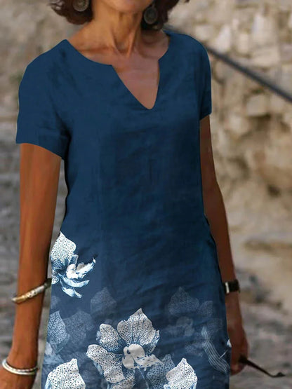 Stylish floral printed mid-length dress made with a cotton-linen blend fabric for a comfortable and feminine look.
