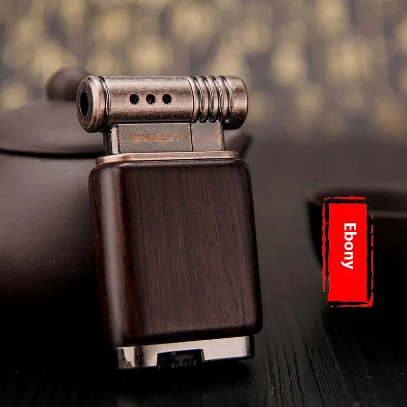 Ebony gas lighter with decorative rosewood and red wood carved panels