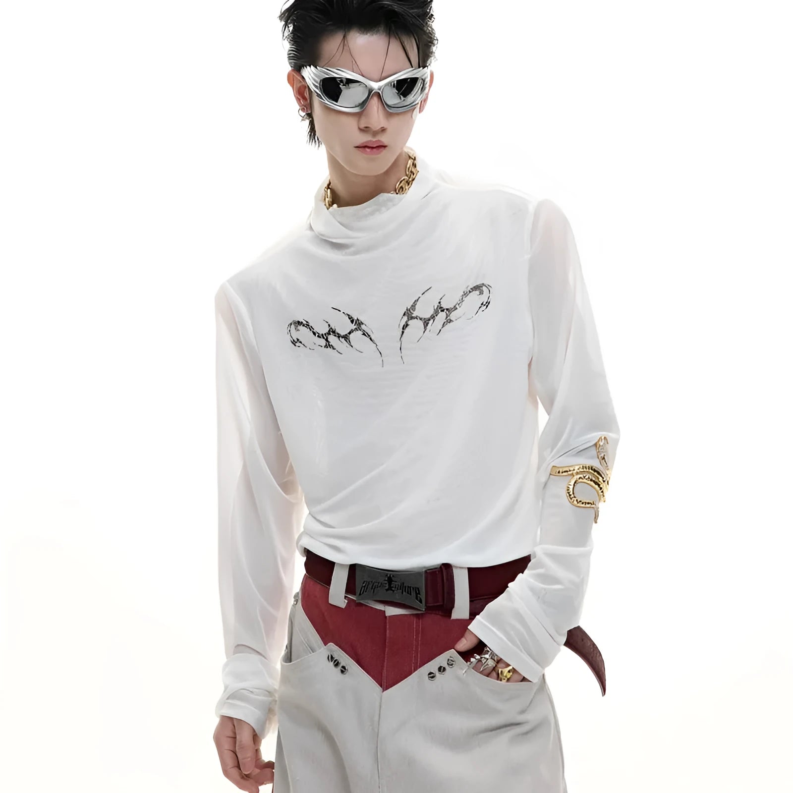 Man wearing a black slim-fit niche mesh long sleeve base layer shirt.