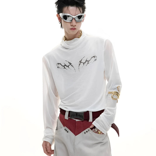 Man wearing a black slim-fit niche mesh long sleeve base layer shirt.