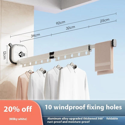 Aluminum retractable drying rack mounted on a window, extending outward for clothes drying