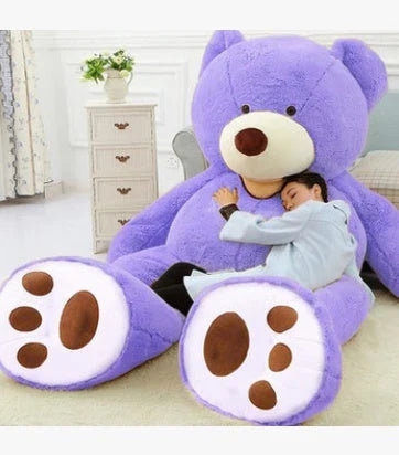 A giant, plush teddy bear in a variety of sizes and colors, including light brown, dark brown, gray, white, pink, and purple.