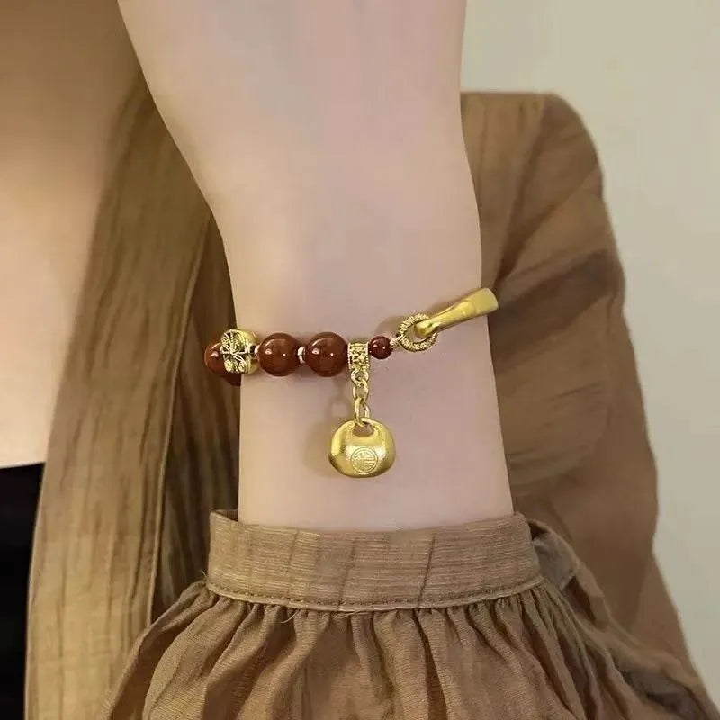 Southern Red Agate Character Ingot Bracelet for women, a golden antique-style lucky bag half bracelet handmade from coloured glass or glaze material with a single-bracelet pack contents.