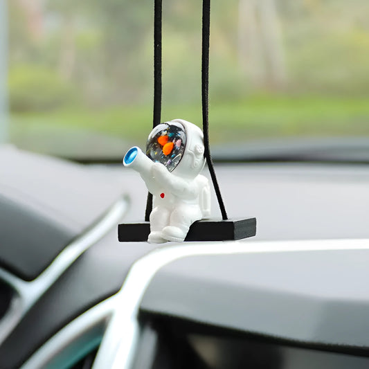 Colourful resin astronaut car pendant ornament with cartoon spaceman design on car dashboard